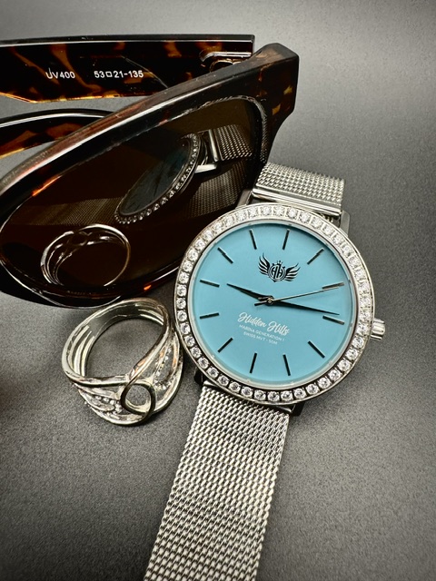 Hidden Hills watch styled with sunglasses and rings