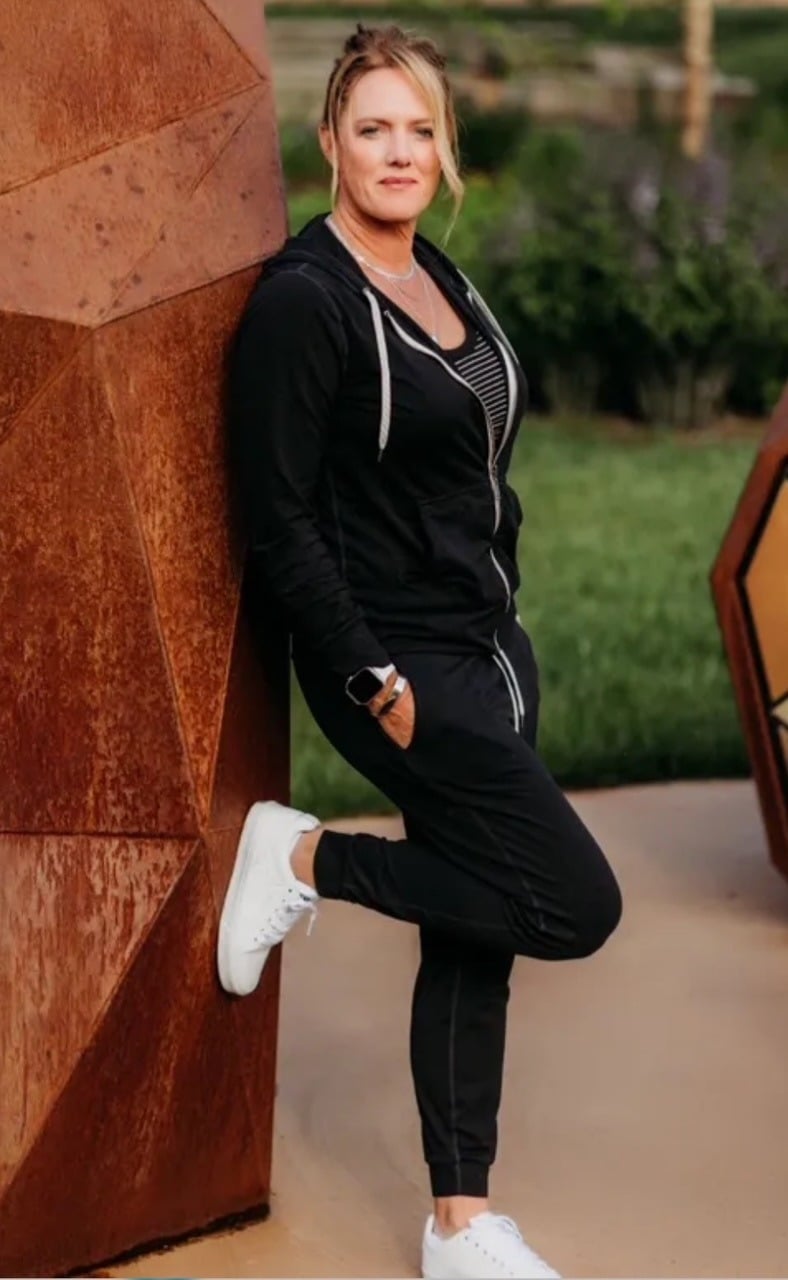 Jennifer Antoine standing outdoors in athletic wear